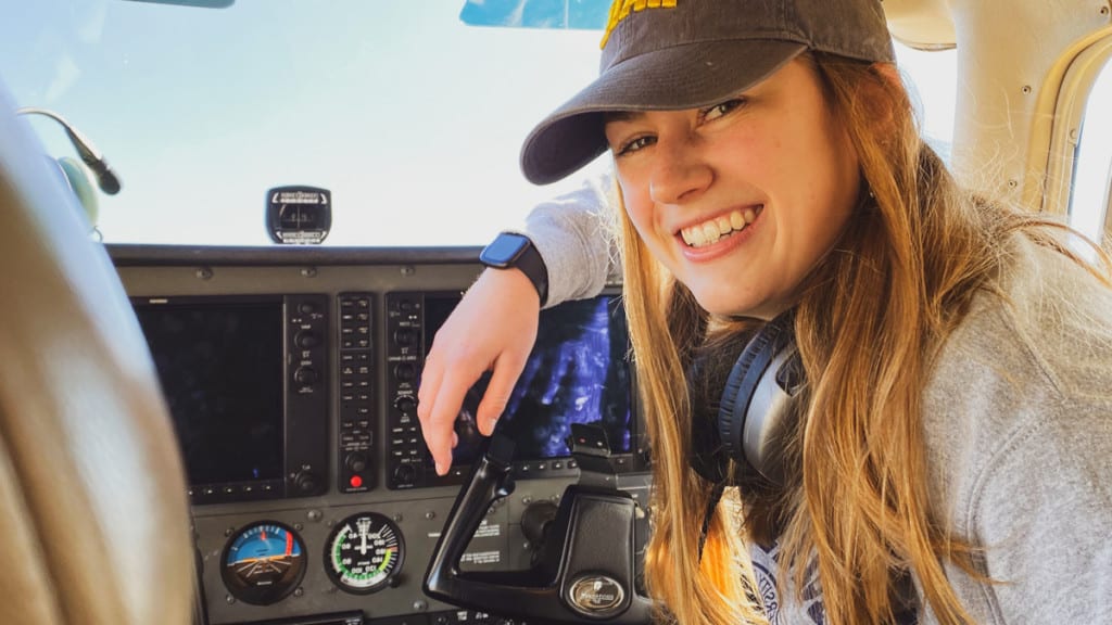 undergrad female student in a cockpit during her project